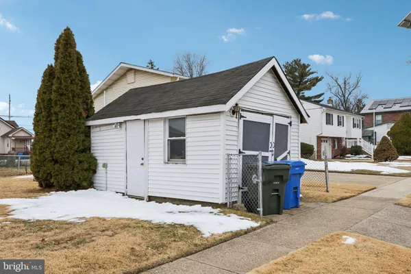a view of a house with wooden fence