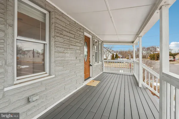 a view of a balcony with wooden floor