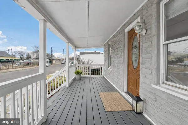 a view of a balcony with wooden floor