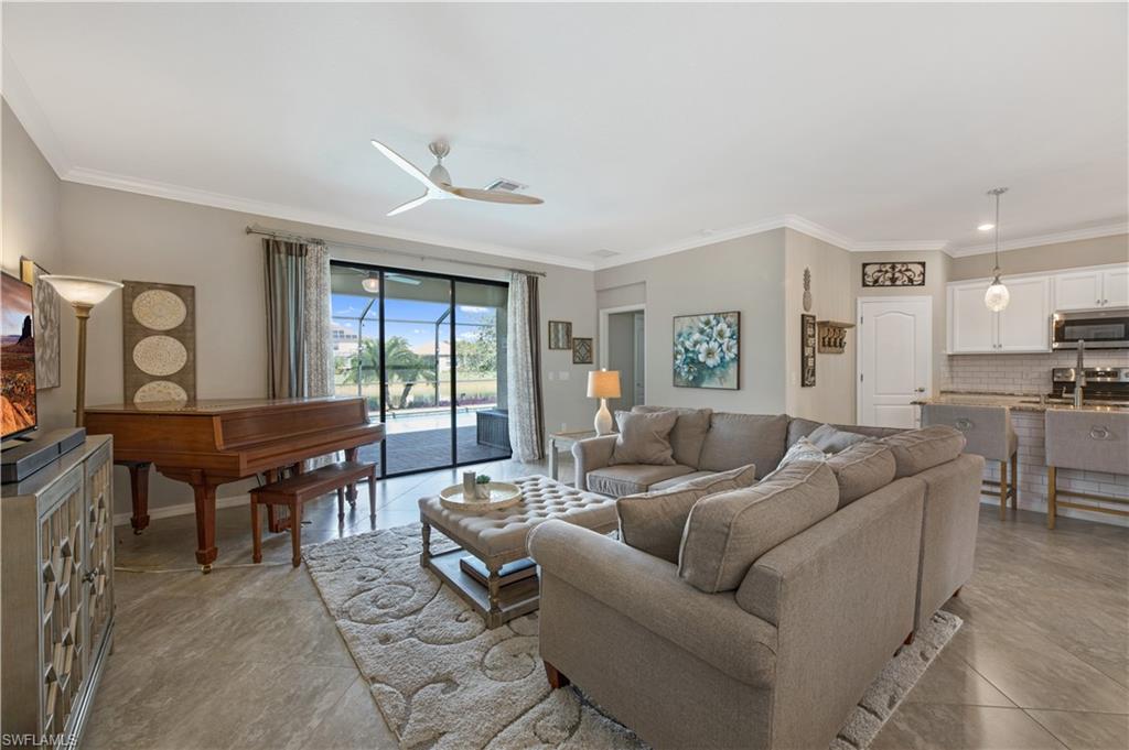 4375 Bismark Way Naples, FL 34119 - Photo 11 of 42 a living room with furniture and a large window