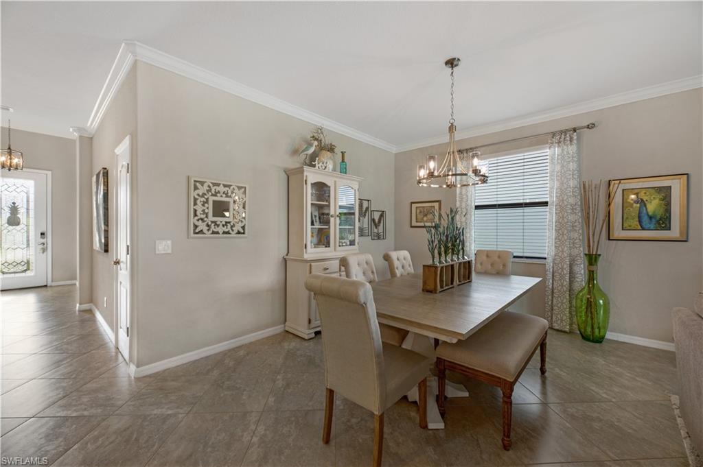 4375 Bismark Way Naples, FL 34119 - Photo 13 of 42 a dining room with furniture and window
