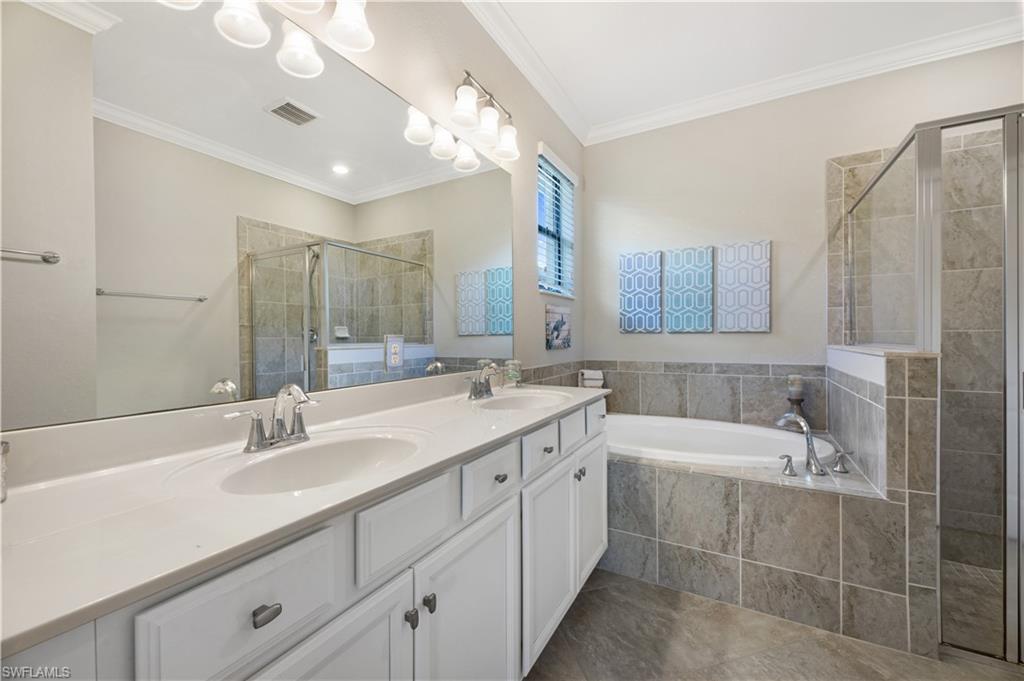 4375 Bismark Way Naples, FL 34119 - Photo 23 of 42 a bathroom with a sink double vanity and a mirror