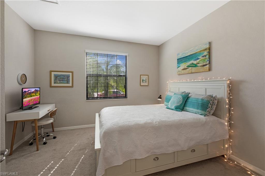 4375 Bismark Way Naples, FL 34119 - Photo 28 of 42 a bedroom with a bed and a window