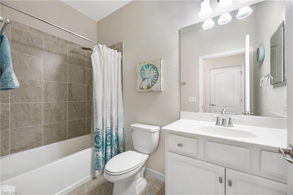 4375 Bismark Way Naples, FL 34119 - Photo 29 of 42 a bathroom with a sink a toilet and a bathtub