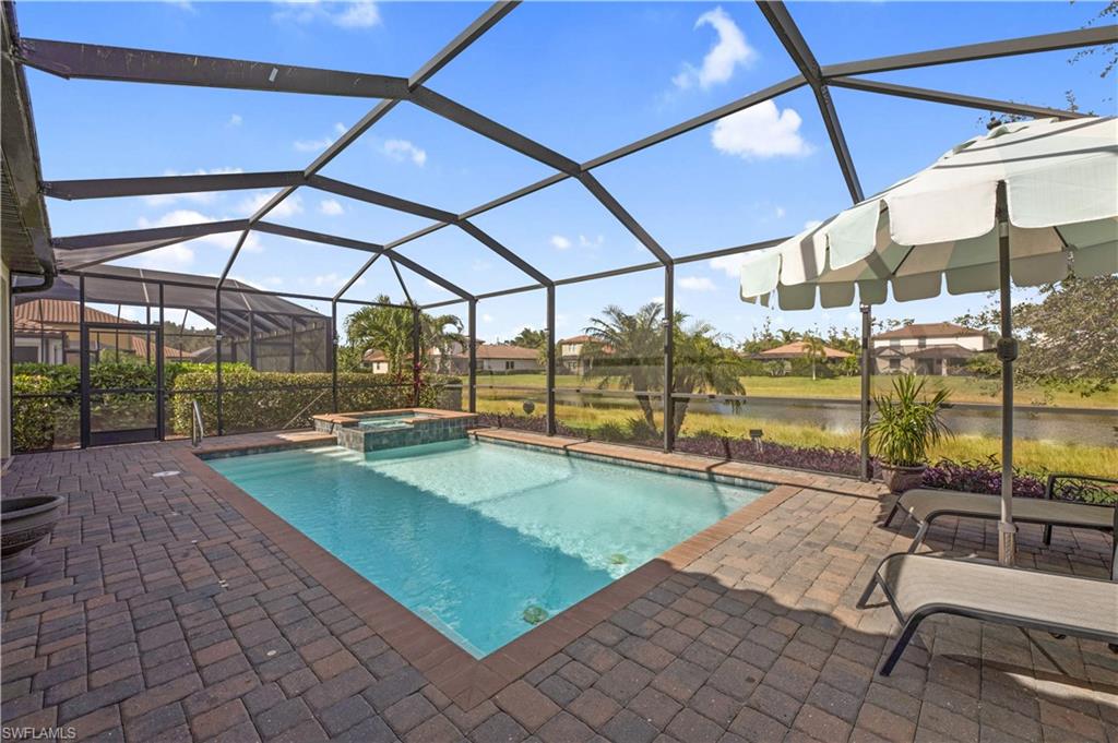 4375 Bismark Way Naples, FL 34119 - Photo 33 of 42 a view of a swimming pool with a porch