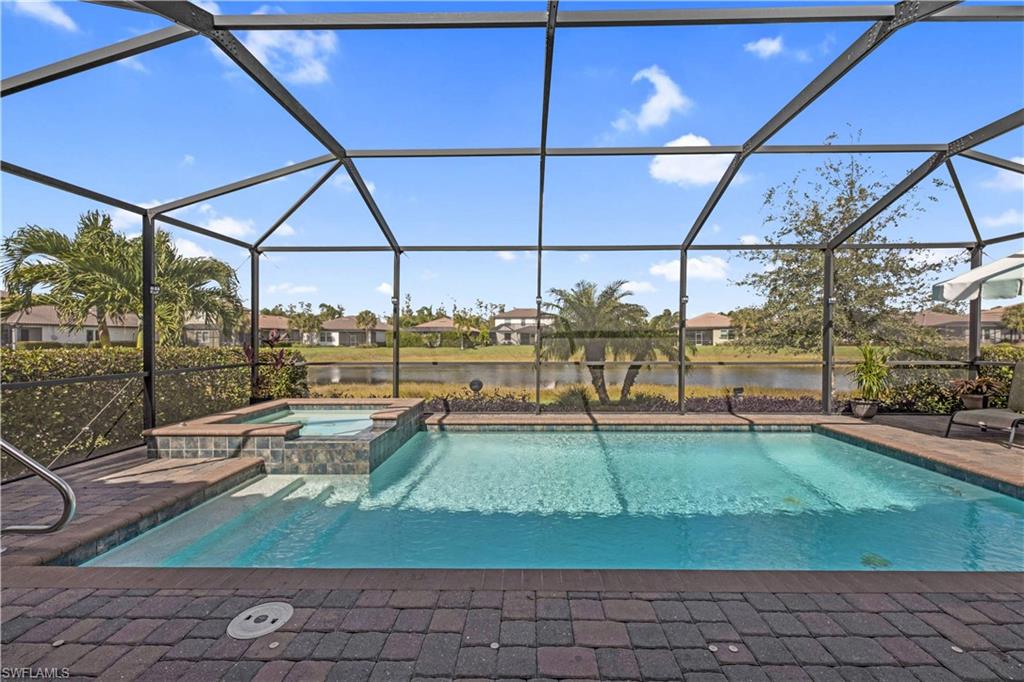 4375 Bismark Way Naples, FL 34119 - Photo 34 of 42 a view of a swimming pool with a yard