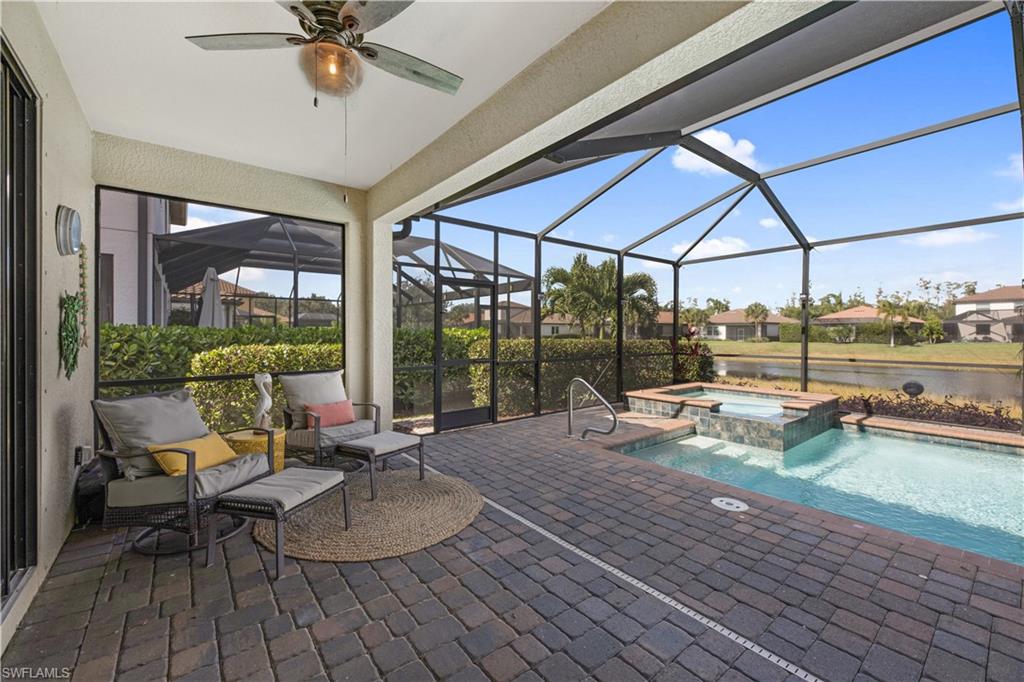 4375 Bismark Way Naples, FL 34119 - Photo 35 of 42 a swimming pool with outdoor seating and yard