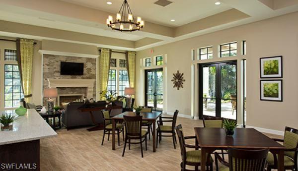 4375 Bismark Way Naples, FL 34119 - Photo 42 of 42 a view of a dining room with furniture window and wooden floor