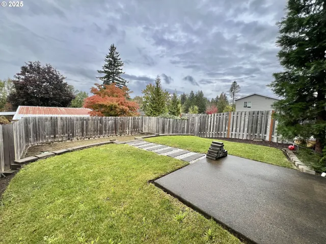 a view of a backyard with a small garden