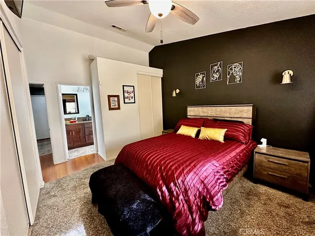 a bedroom with a bed and a couch