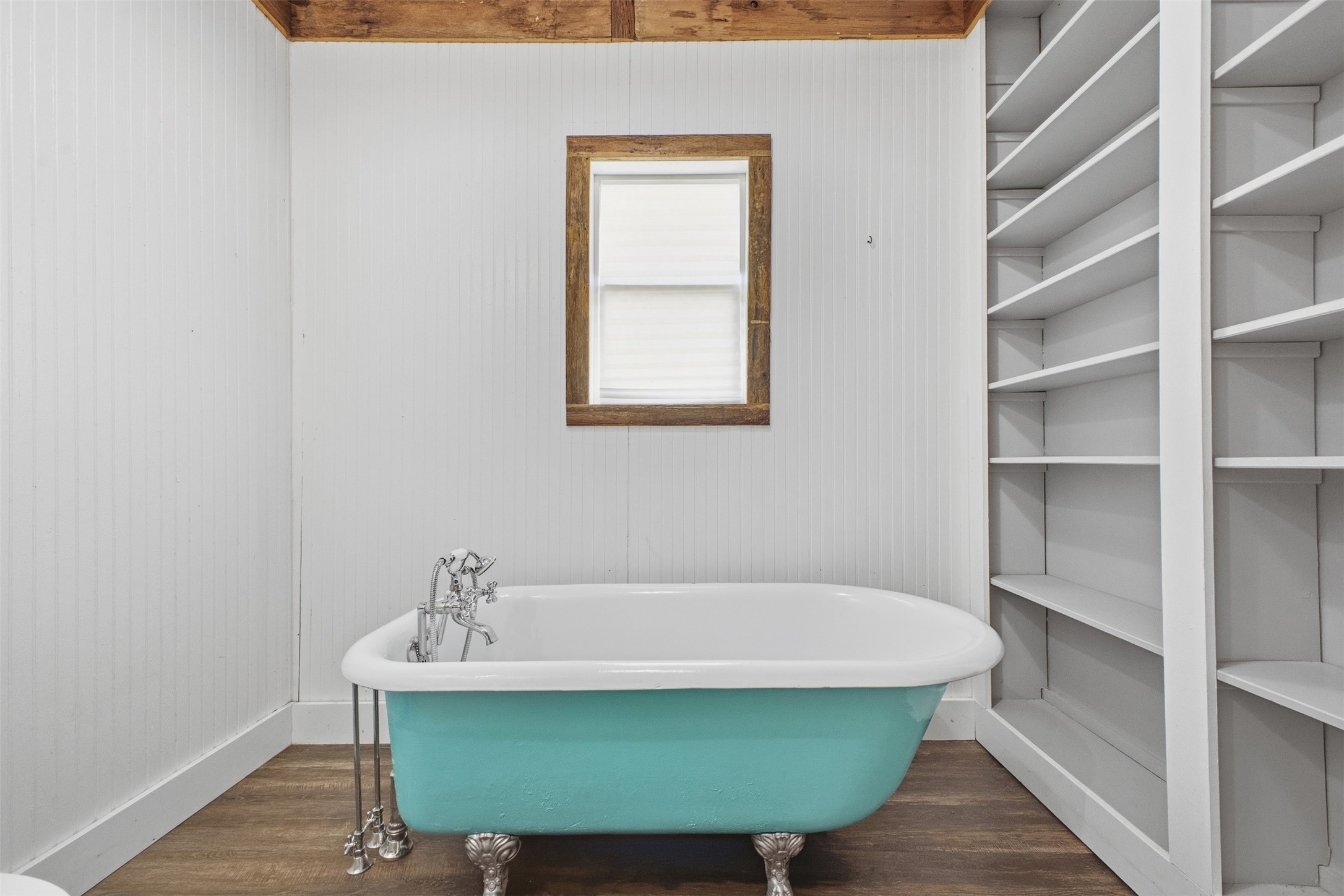 1903 Tigerpoint Road Brenham, TX 77833 - Photo 15 of 27 a bathroom with a bathtub and a window