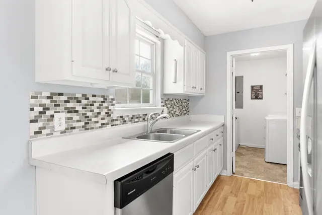 a kitchen with a stove and a sink