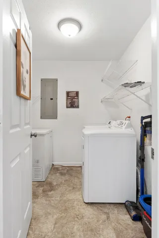 an empty room with fan and windows