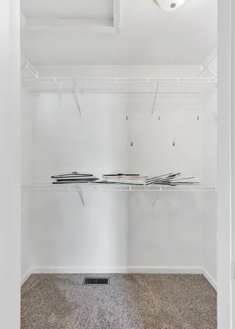 a bathroom with a sink a toilet a mirror and shower