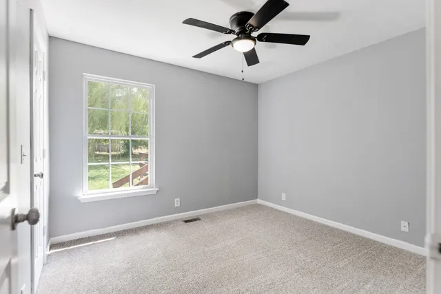 a view of a house with backyard porch and sitting area