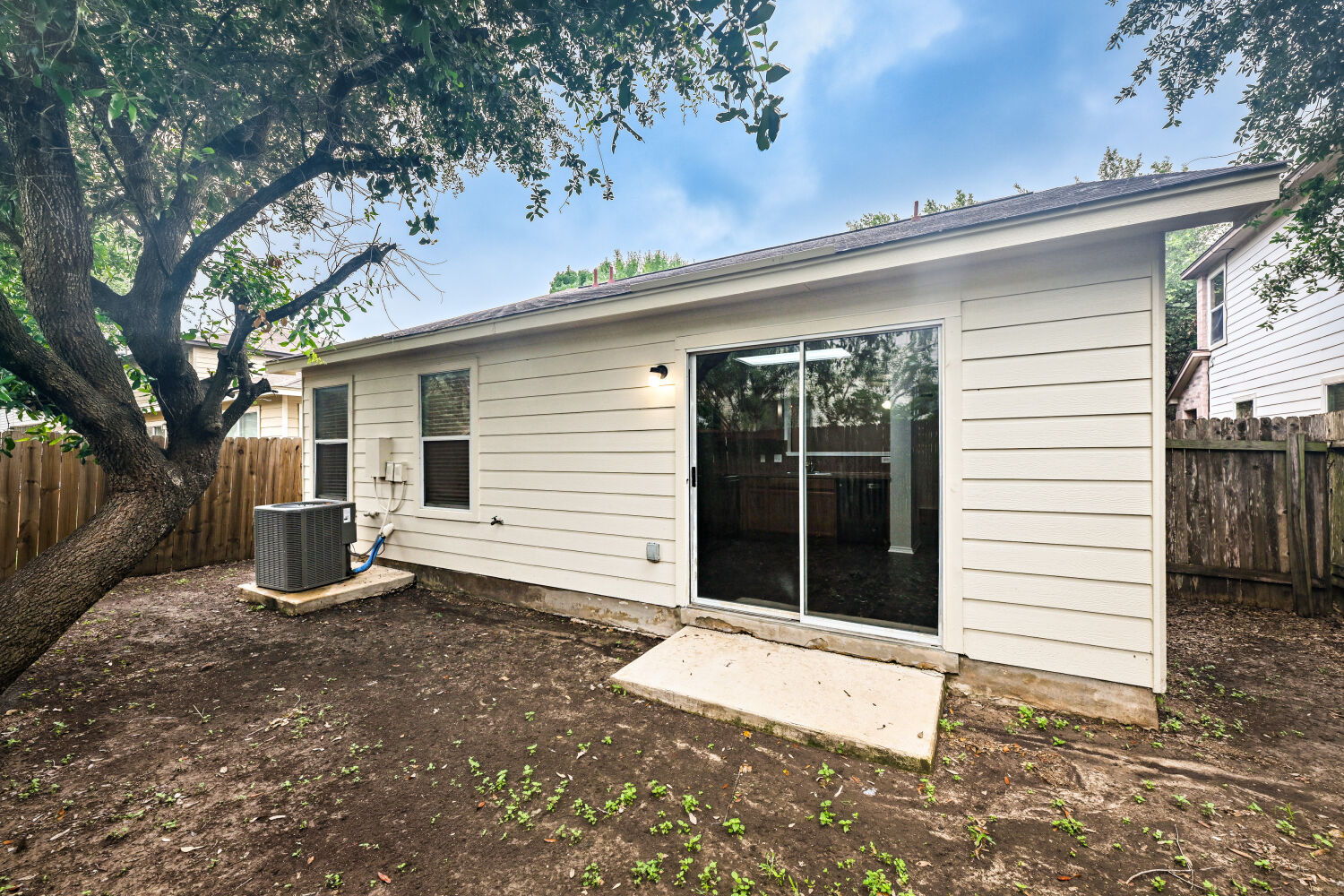 6733 Doyal Drive Austin, TX 78747 - Photo 24 of 28 A private backyard oasis with direct interior access through a sliding glass door.