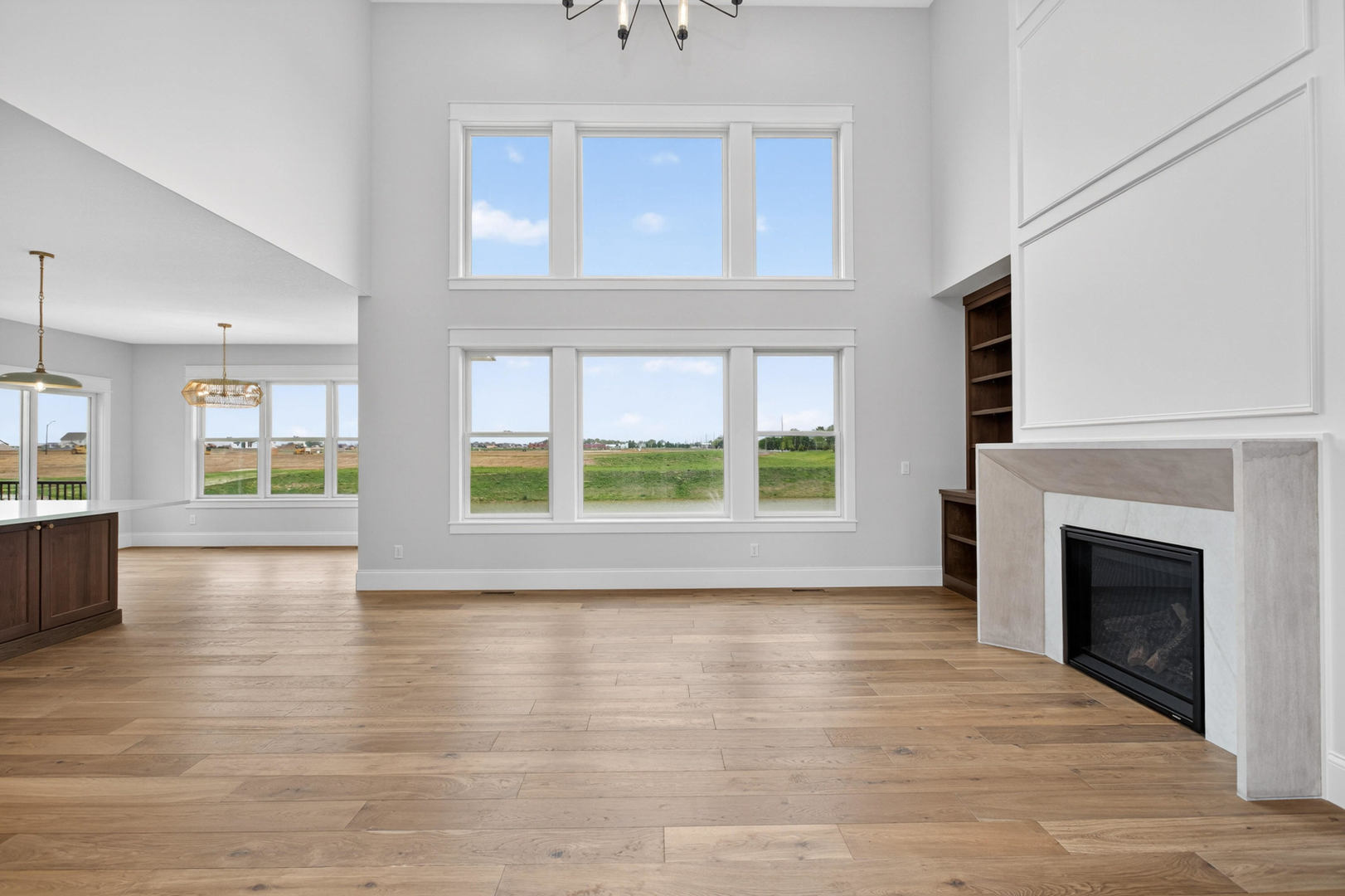6928 Wilderness Pointe Bettendorf, IA 52722 - Photo 10 of 48 a view of an empty room with wooden floor and a window