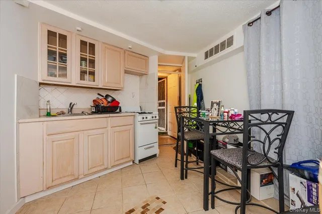 a dining room filled with furniture and entryway