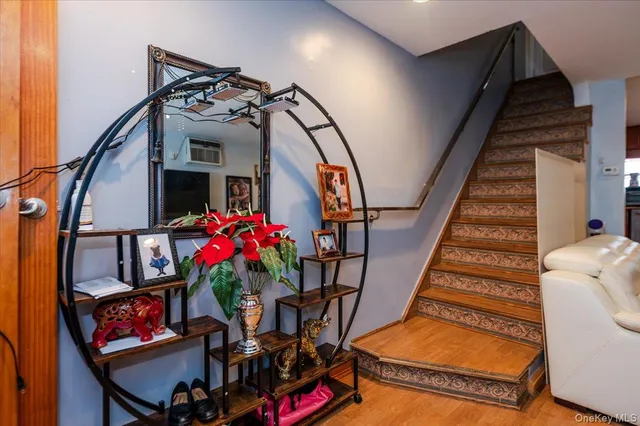 a view of an entryway with wooden floor