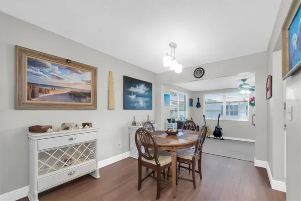 a dining room with furniture and window