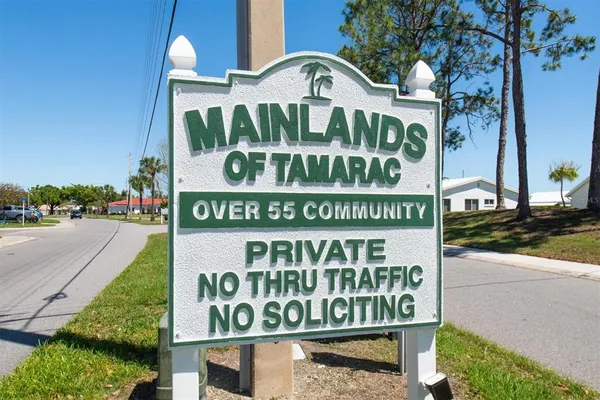 a sign on a pole on a street