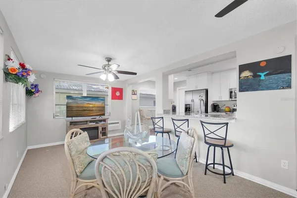 a view of a livingroom with furniture and a flat screen tv