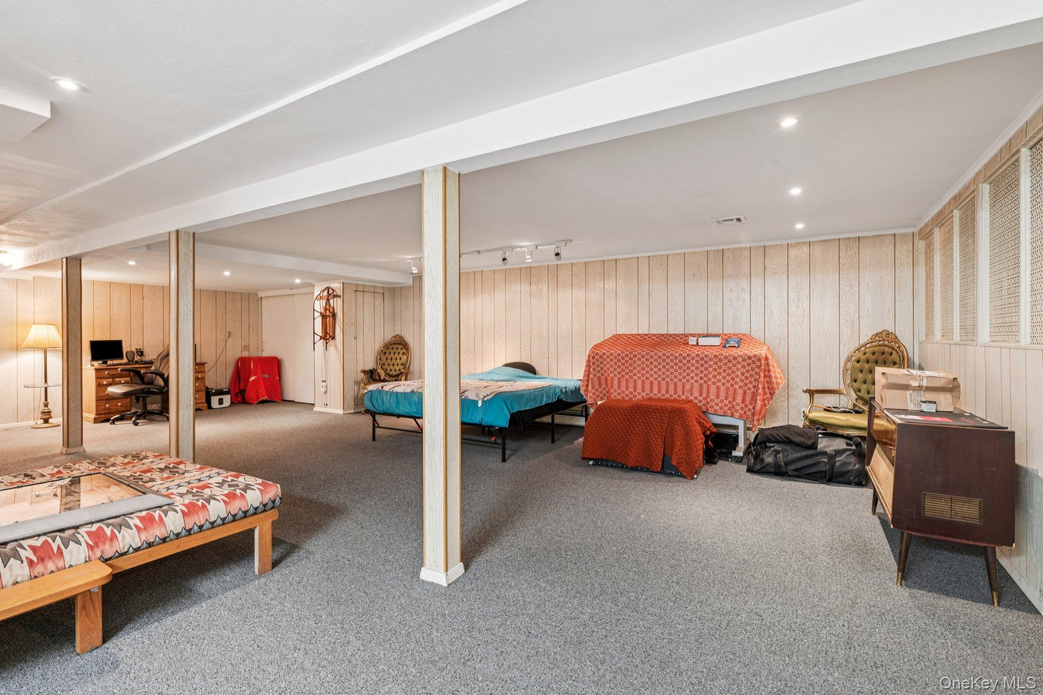 22 Reynolds Road Glen Cove, NY 11542 - Photo 15 of 22 a bed room with furniture and a mirror