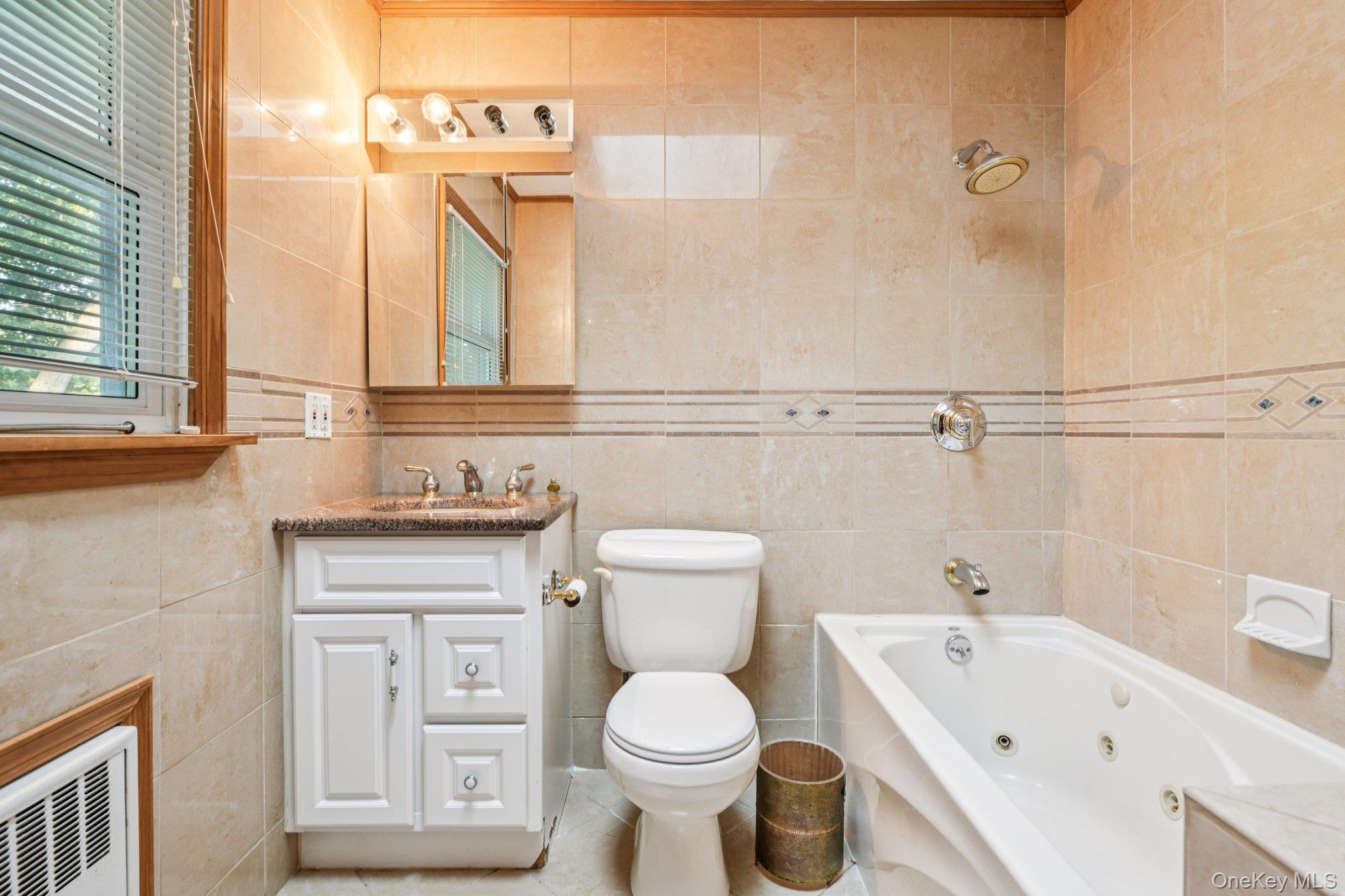 22 Reynolds Road Glen Cove, NY 11542 - Photo 18 of 22 a bathroom with a toilet sink and mirror