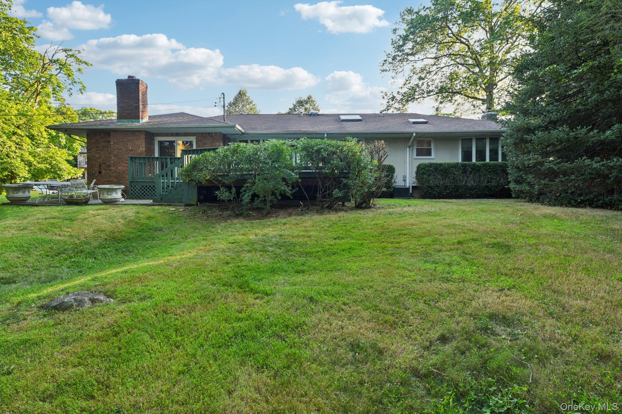 22 Reynolds Road Glen Cove, NY 11542 - Photo 3 of 22 a front view of a house with garden
