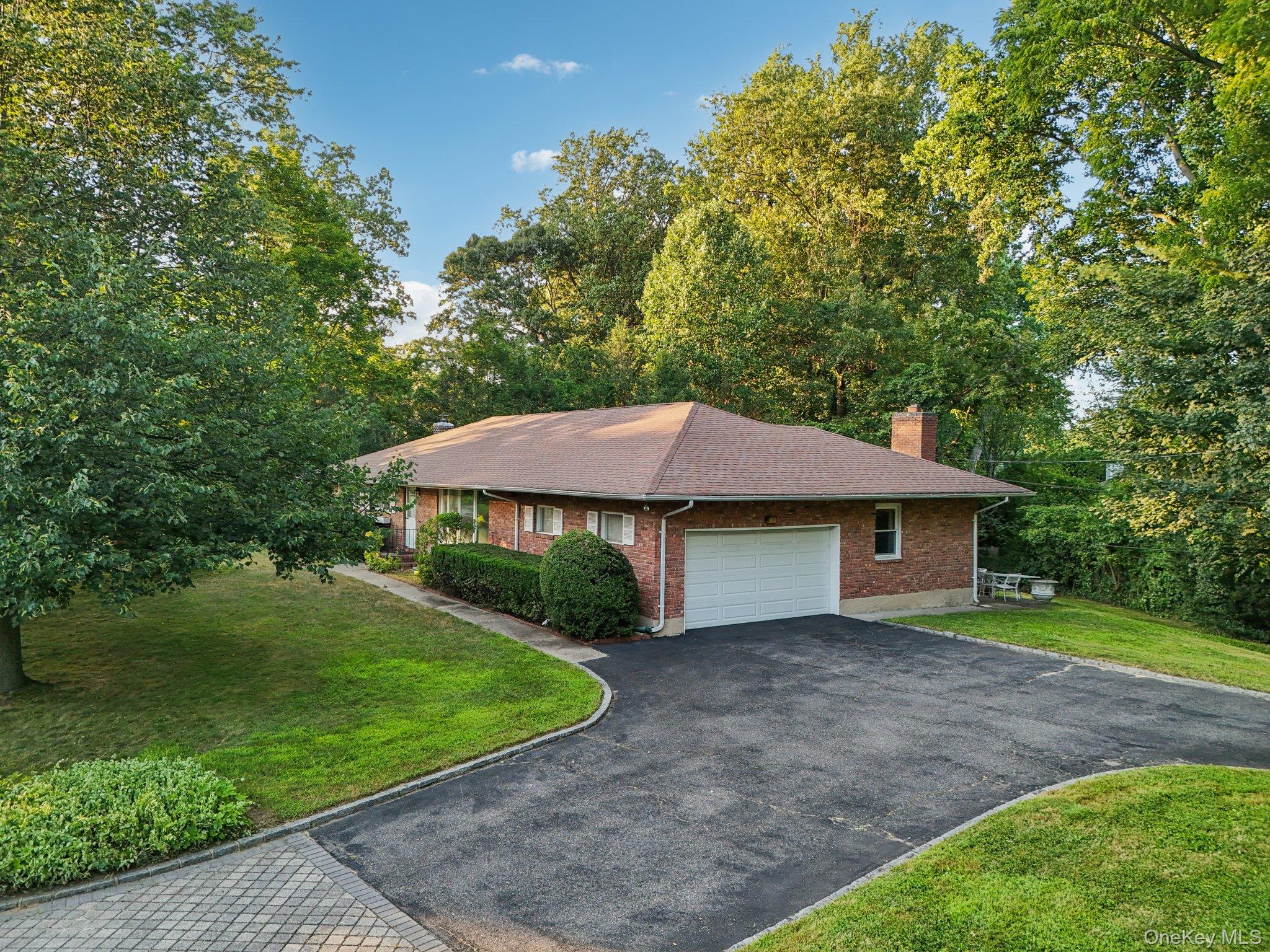 22 Reynolds Road Glen Cove, NY 11542 - Photo 4 of 22 a house with trees in the background