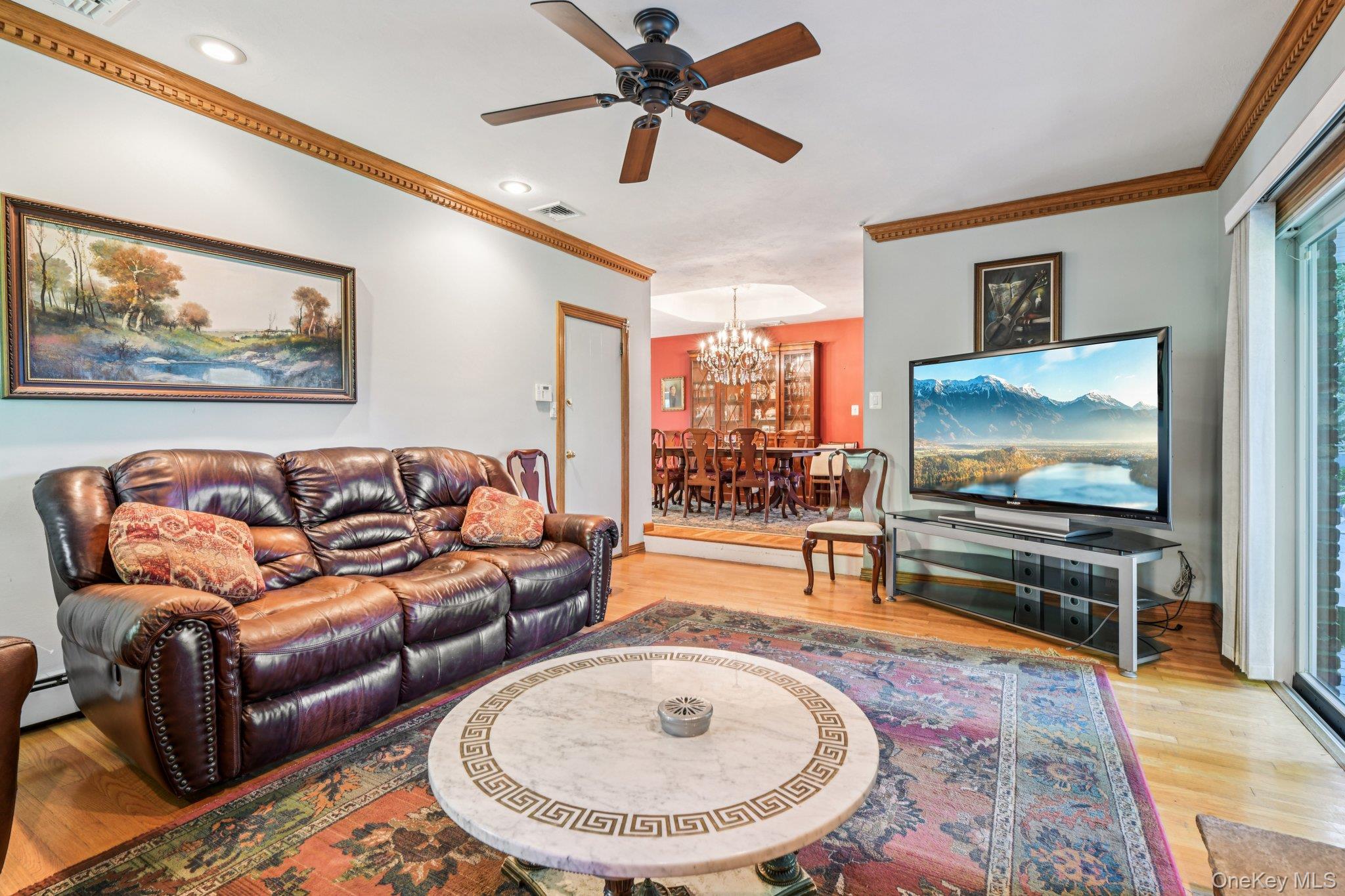 22 Reynolds Road Glen Cove, NY 11542 - Photo 6 of 22 a living room with furniture and a flat screen tv