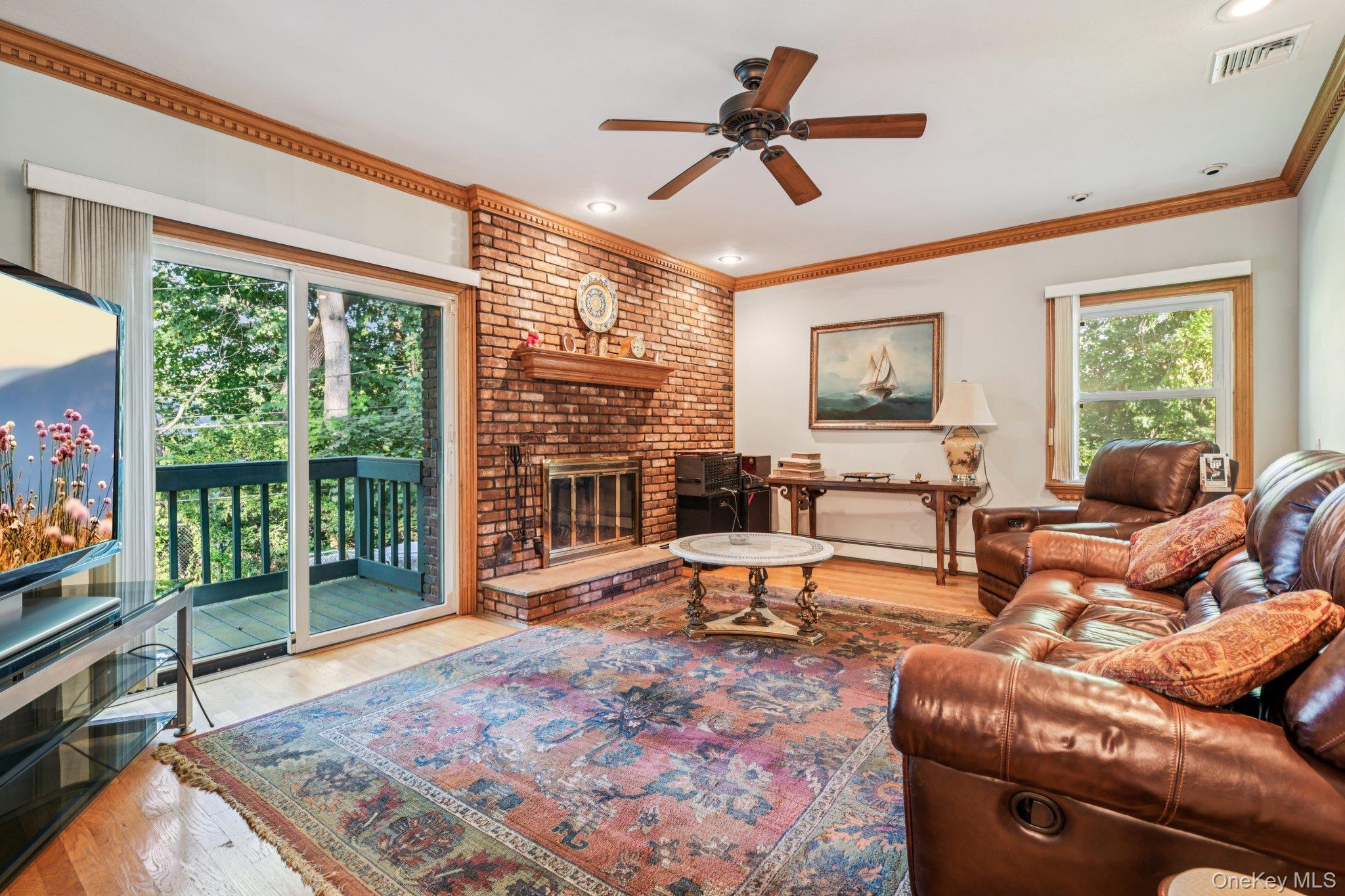 22 Reynolds Road Glen Cove, NY 11542 - Photo 8 of 22 a living room with furniture and a large window