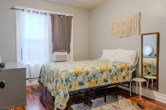 a bedroom with a bed and a table in it