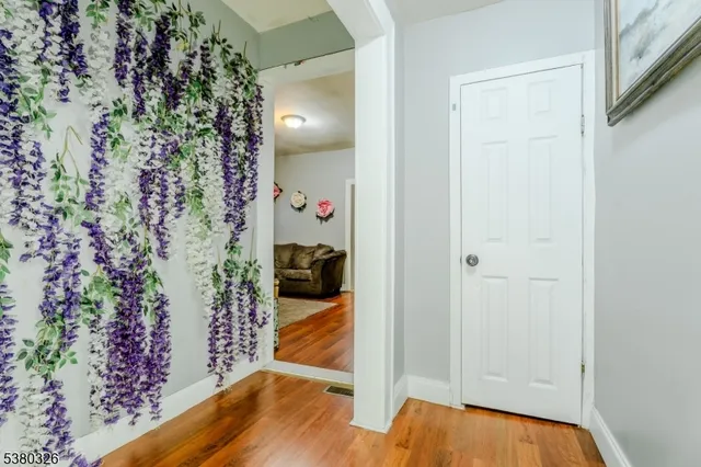 a view of a bedroom & wooden door