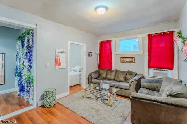 a living room with furniture and flowers