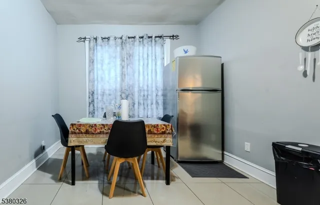 a dining room with furniture and a chandelier