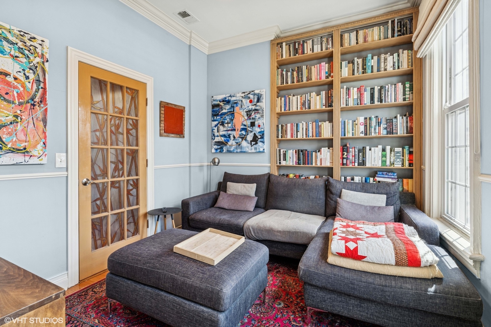 2249 West Warren Boulevard Chicago, IL 60612 - Photo 11 of 25 a living room with furniture a bookshelf and a book shelf