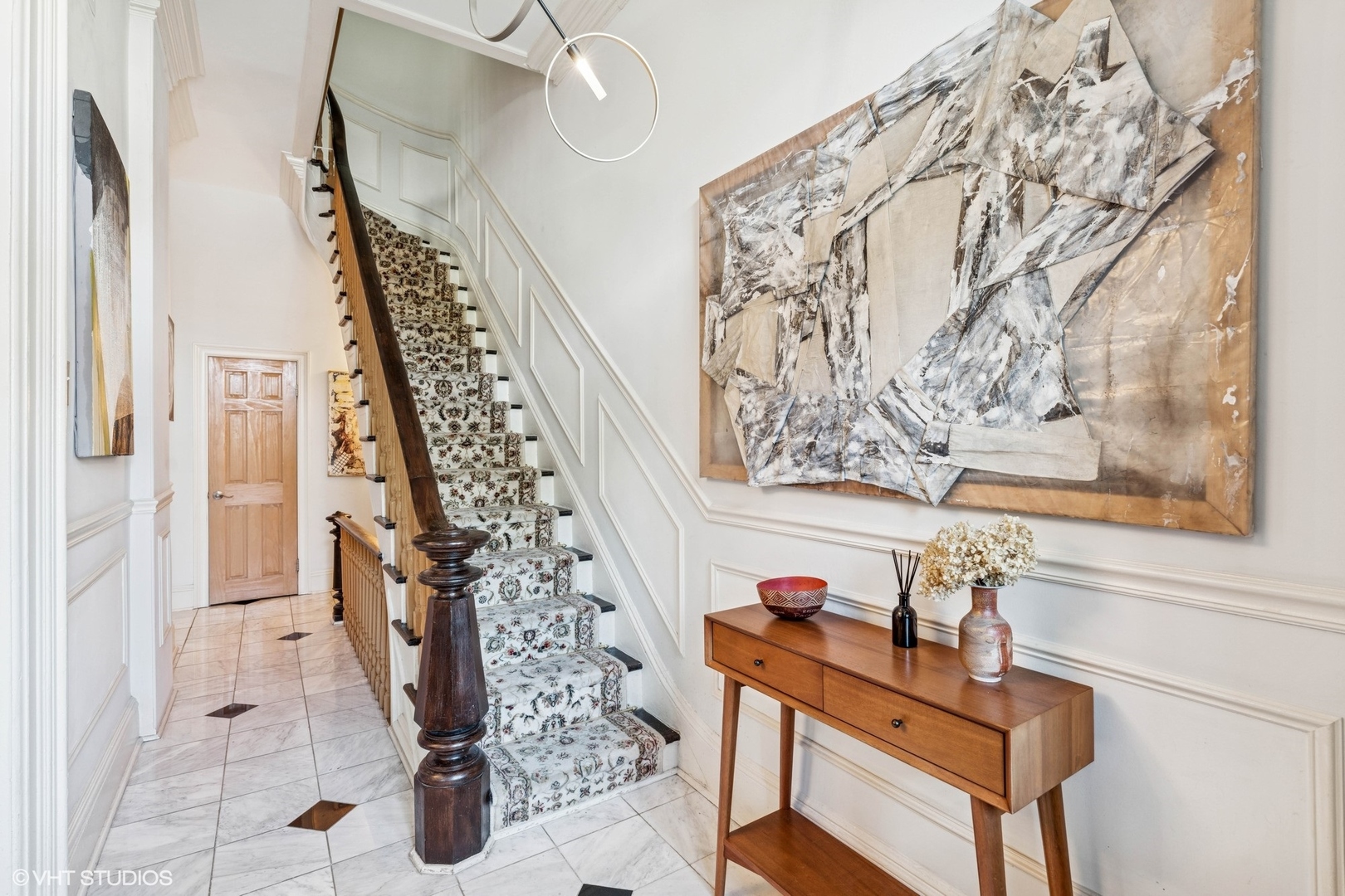 2249 West Warren Boulevard Chicago, IL 60612 - Photo 4 of 25 a view of a entryway with furniture and stairs