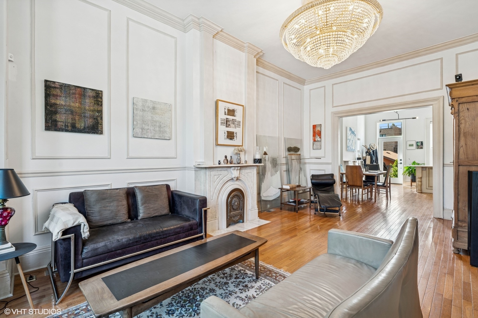 2249 West Warren Boulevard Chicago, IL 60612 - Photo 7 of 25 a living room with furniture a fireplace and a table