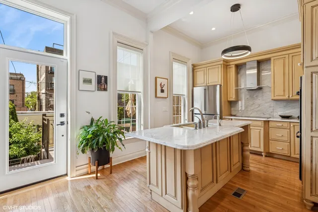 a spacious bathroom with a granite countertop sink a mirror and a shower