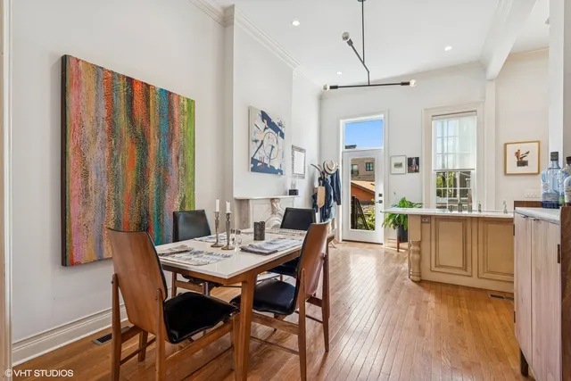 a view of a dining room with furniture and wooden floor