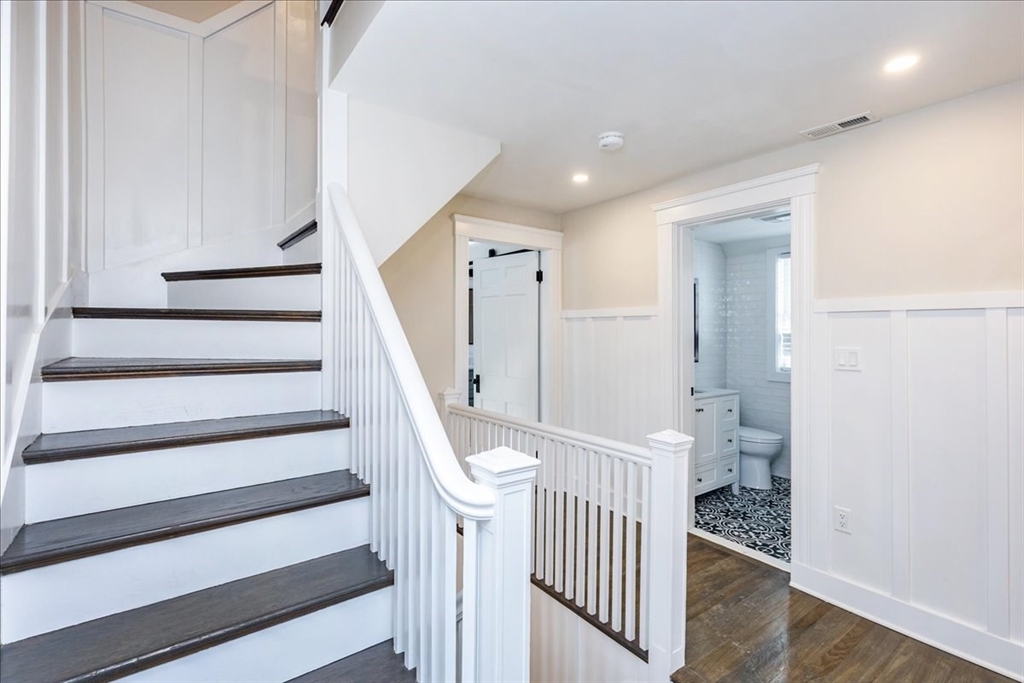 37 Wolcott Road Brookline, MA 02467 - Photo 16 of 41 a view of entryway with stairs and wooden floor
