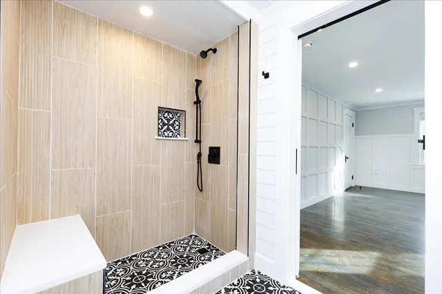 a bathroom with a shower and a sink