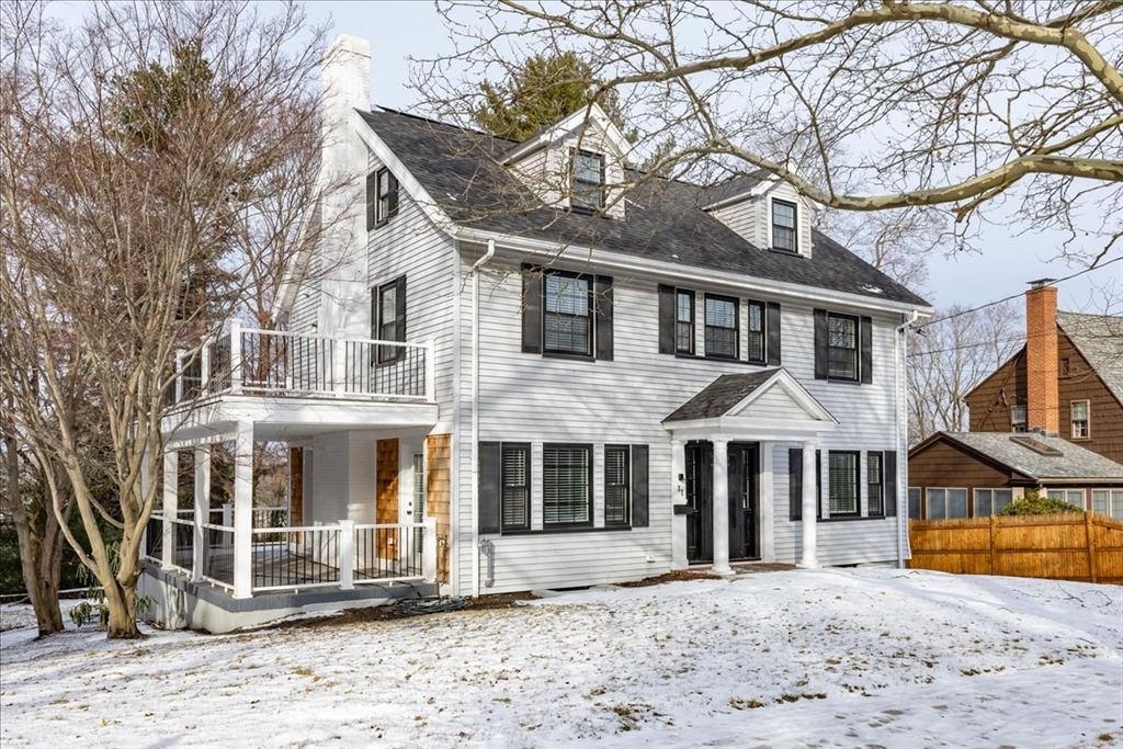 37 Wolcott Road Brookline, MA 02467 - Photo 2 of 41 a front view of a house with a yard