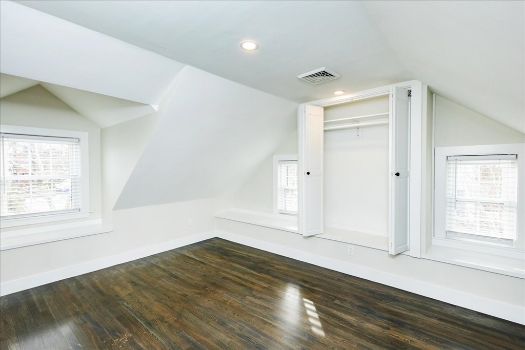 37 Wolcott Road Brookline, MA 02467 - Photo 28 of 41 an empty room with wooden floor and windows