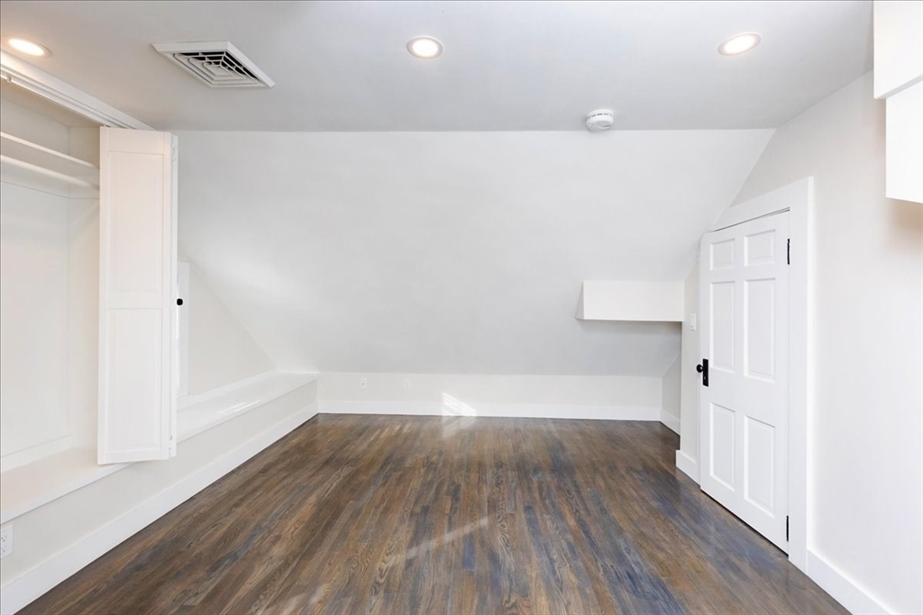 37 Wolcott Road Brookline, MA 02467 - Photo 29 of 41 a view of a room with wooden floors and led lights