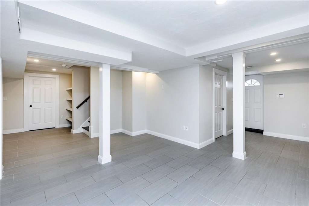 37 Wolcott Road Brookline, MA 02467 - Photo 32 of 41 an empty room with white walls and entryway