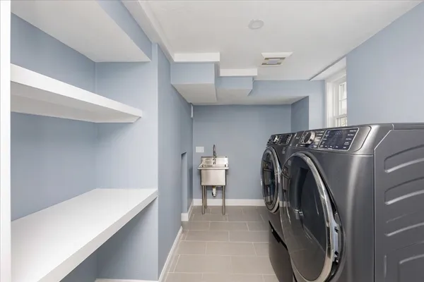 a view of a storage & utility room with washer and dryer