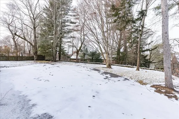 a view of empty space with snow on the road