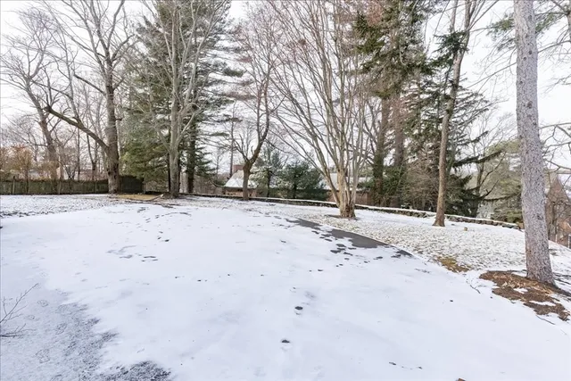a view of empty space with snow on the road